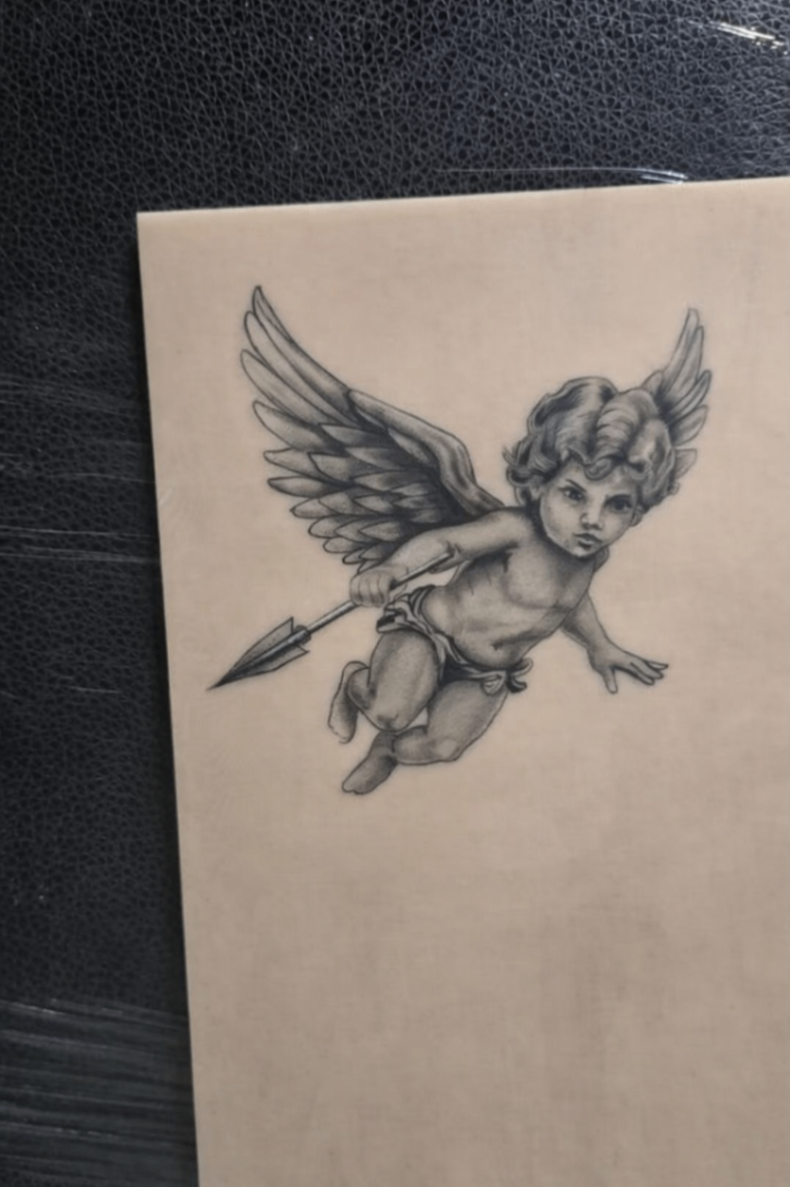Cherub angel with spear tattoo on fake skin