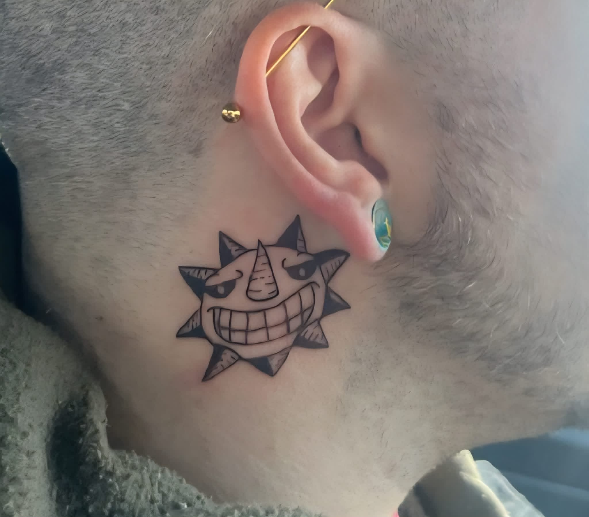 Soul Eater sun face neck tattoo
